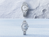 The Grand Seiko SBGX359 (top) and SBGX361 (bottom), pictured against stylized snow and sky backgrounds.