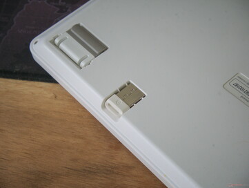 A cleverly designed flip-out foot and a 2.4 GHz dongle holder show attention to detail. 