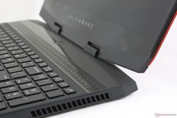 The plastic glossy speaker grilles and bezels contrast the otherwise all-matte look