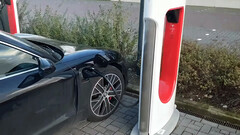 Electric Porsche plugged in a Tesla Supercharger station (image: Inse van Houts/YouTube)