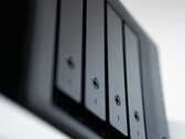 Close-up shot of a black NAS enclosure with multiple drive bays