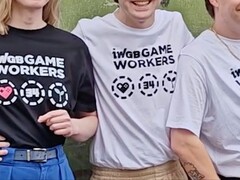Fired Rockstar employees showcasing T-shirts to support legal battle.