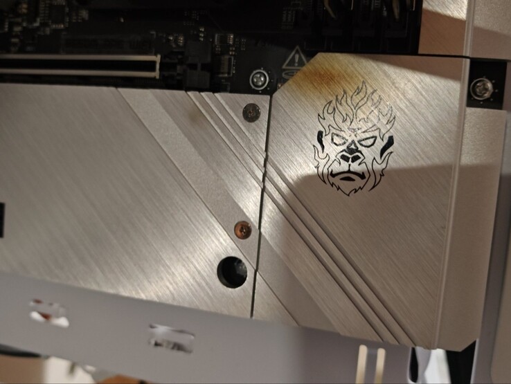 The burn mark on the motherboard from the GPU fire.