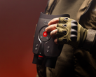 The DVX Night Storm X3, pictured in the hands of a person wearing outdoor gloves and gear against a red background. (Image source: DVX)