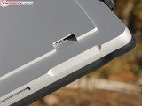 The card reader is located underneath the fold-out stand