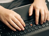 Hands typing on a laptop keyboard, symbolic image for Anthropic Claude Haiku 5.5