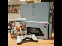 A custom hand-built “PS3 Slim Pro” with a 30th Anniversary logo beside a DualShock 3 controller and The Last of Us box. (Image source: Fun-Equivalent-7785 via Reddit /r/PS3)