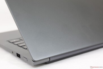 Slightly roughened matte metal finish from top to bottom. The dark gray color scheme hides fingerprints well