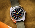 The Timex x Bespoke Post limited-edition 36mm watch, pictured with an olive Cordura strap against a dark mustard background. (Image source: Timex)