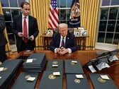 President Donald Trump, signing executive orders. (Image source: The White House)