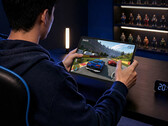 The new 11-inch gaming tablet has a starting retail price of around $456. Pictured: a promo picture showing the Y900 11 running a game.