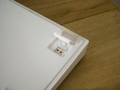 Two stage flip out feet and wireless dongle storage