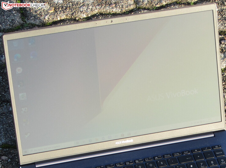 The VivoBook outdoors (shot in bright sunshine).