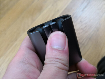 To remove the earbuds, you simply slide your thumb up