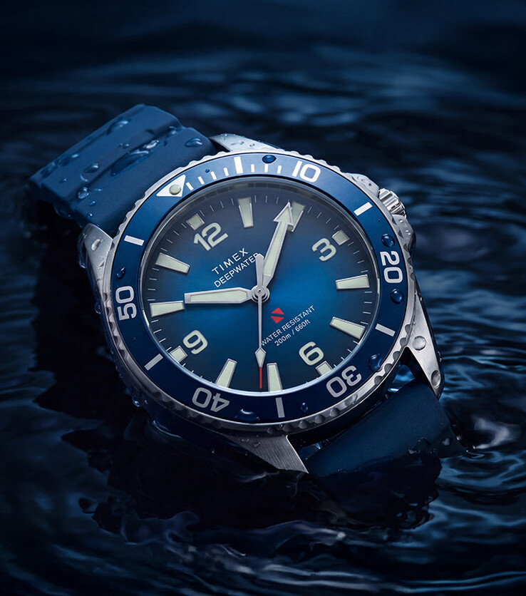 Timex Deepwater Arctic 200 with a blue dégradé dial and matching blue HNBR rubber strap, photographed partially submerged in water.