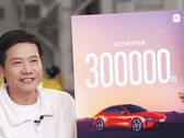 Xiaomi's CEO with the SU7's new target. (Image source: Xiaomi)