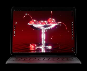 Apple iPad Pro M5 with Magic Keyboard displaying a 3D render of cherries, showcasing the Ultra Retina XDR OLED display and M5 chip graphics (Image source: Apple)