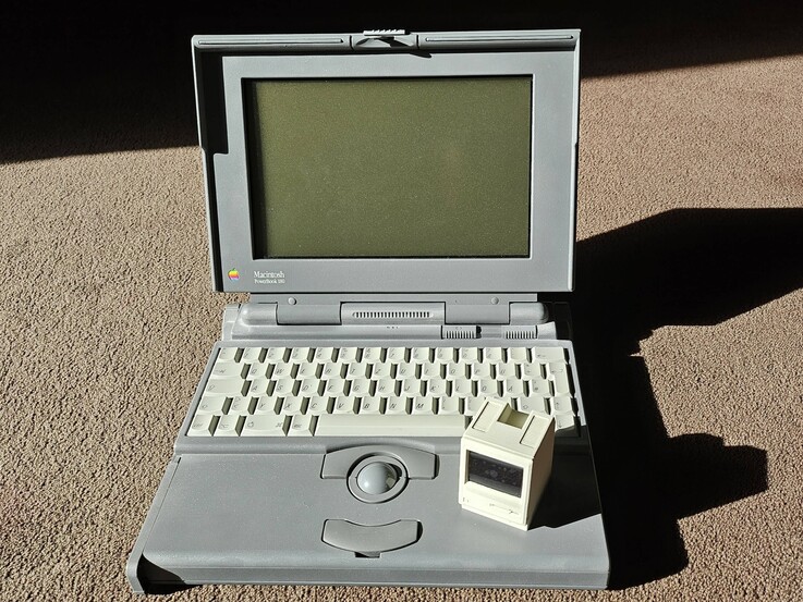 The Pico Mac Nano in size comparison with a Powerbook 180.