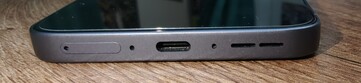 Bottom: SIM slot, microphone, USB-C port, microphone, speakers