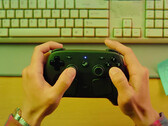 The Steam Controller will reportedly launch on May 4, 2026. Pictured: a promo shot of the controller being held.