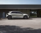 The Hyundai Ioniq 5 charging in front of a building (Image source: Hyundai Motor Group via Unsplash; cropped)