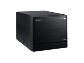 The image shows a head-on view of the Shuttle XPC Mini PC, which looks like a black cube with a minimal design. 