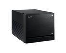 The image shows a head-on view of the Shuttle XPC Mini PC, which looks like a black cube with a minimal design.