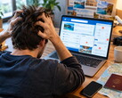 Person sitting at a laptop having trouble with a travel booking 