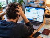 Person sitting at a laptop having trouble with a travel booking 