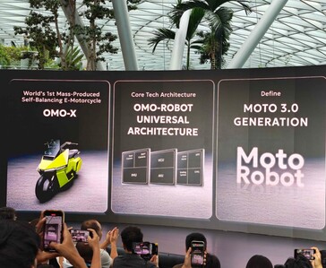 Omoway OMO-ROBOT architecture and OMO X self-balancing electric motorcycle shown during the Singapore launch event.
