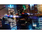 A screenshot taken from GTA V Enhanced that shows off the newly added ray tracing. A bike rides through a slick street at night, with a cop car closely behind. (Image Source: Steam)