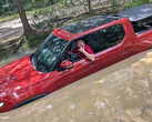 The Rivian R1T wades in deep water (Image source: Il Babbuino/X)