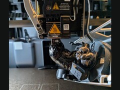 A blob of filament on Bambu Lab 3D printer nozzle