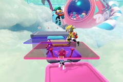 Popucom screenshot with characters on platforms in clouds solving puzzles