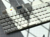 This Apple Desktop Bus Keyboard from 1986 is wireless and has a built-in OLED display and rotary knob. (Image source: mtt on YouTube)
