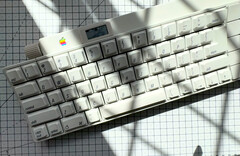 This Apple Desktop Bus Keyboard from 1986 is wireless and has a built-in OLED display and rotary knob. (Image source: mtt on YouTube)
