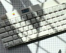 This Apple Desktop Bus Keyboard from 1986 is wireless and has a built-in OLED display and rotary knob. (Image source: mtt on YouTube)