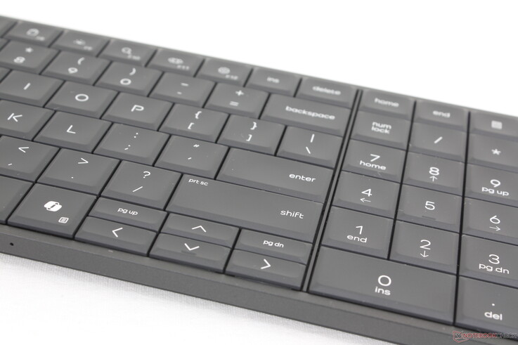 Spill-resistant backlit keyboard with numpad is comfortable to type on except for the half-sized arrow keys