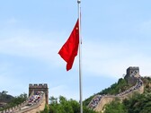 The Chinese flag with the Great Wall of China in the background