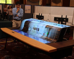 LG shows a potential application for its 77-inch flexible OLED as a smart desk. (Source: LG Display)