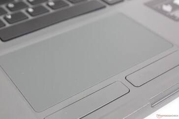 Touchpad with dedicated mouse buttons. The buttons are shallower, lighter, and quieter than expected with relatively weak feedback