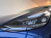A closeup shot of the 2021 Model 3's LR headlight
