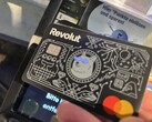 We use the Revolut card with illuminated eyes to pay at a contactless terminal