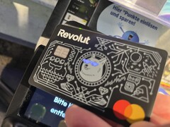 We use the Revolut card with illuminated eyes to pay at a contactless terminal