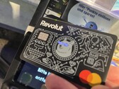 We use the Revolut card with illuminated eyes to pay at a contactless terminal