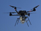 An airbone drone carrying the parachute (Image source: NASA and Christopher LC Clark; cropped)