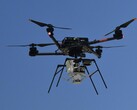 An airbone drone carrying the parachute (Image source: NASA and Christopher LC Clark; cropped)