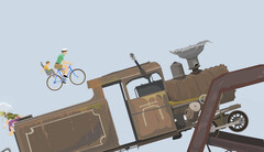 Happy Wheels gameplay showing a father and child riding a bicycle towards a large locomotive on a user-created obstacle course.