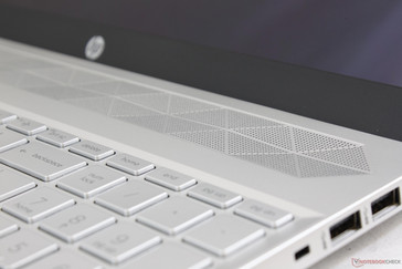 Bang and Olufsen speaker grilles along the top of the keyboard