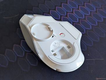 The removable magnetic cover on the bottom houses the wireless receiver when traveling with the mouse